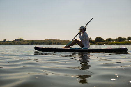 Serene Paddleboarding on a Calm Lake