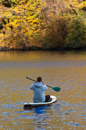 Supboarding in Autumn Foliageの写真素材