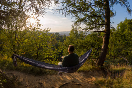 Relaxing in a Hammock at Sunsetの写真素材