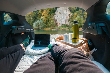 Cozy Car Retreat by the Riverの写真素材