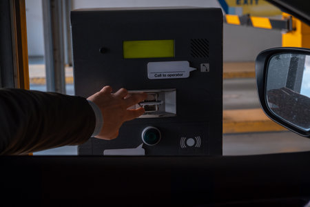 Driver Using Payment Machine at Parking Facilityの写真素材