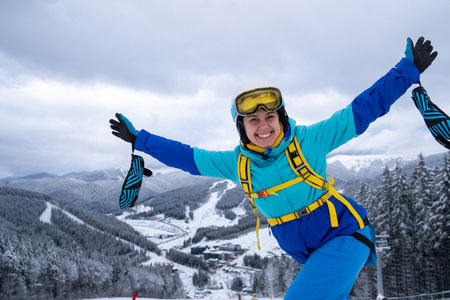 Smiling Skier on Snowy Slopeの写真素材