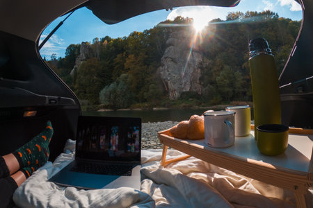 Cozy Car Retreat by the Riverの写真素材