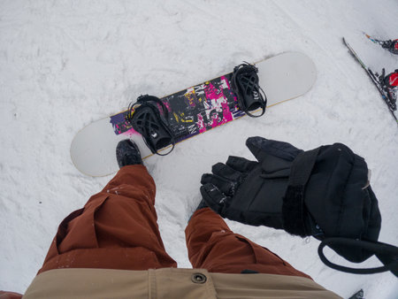 Snowboarder Preparing for a Rideの写真素材