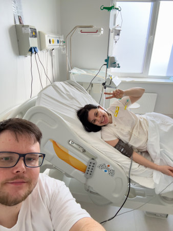 Smiling Couple in Hospital Roomの写真素材