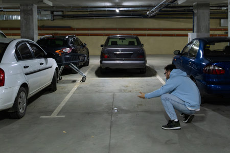 Person in Underground Parking Garageの写真素材