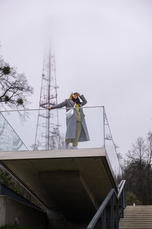 woman on outdoors balcony at foggy weatherの写真素材