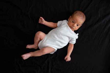Newborn Baby on Black Backgroundの写真素材