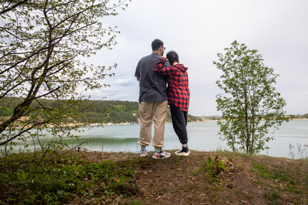 Couple Enjoying Scenic Lake Viewの写真素材