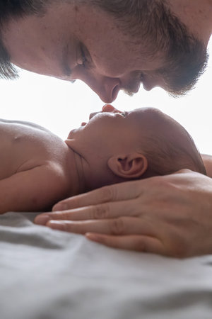 Father and Newborn Sharing a Tender Momentの写真素材