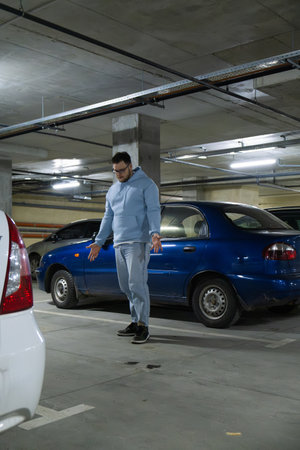 Person in Underground Parking Garageの写真素材