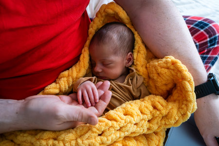 Newborn Baby Holding Adults Handの写真素材