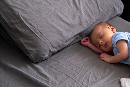 Peaceful Sleeping Baby on Gray Blanket