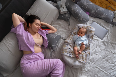 Mother and Baby Relaxing Together on Bed
