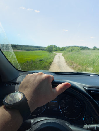 Driving on a Scenic Rural Dirt Roadの写真素材
