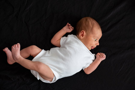 Newborn Baby on Black Background