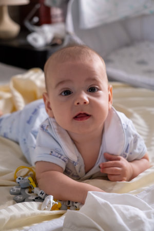 Happy Baby Playing with Toys on a Blanketの写真素材