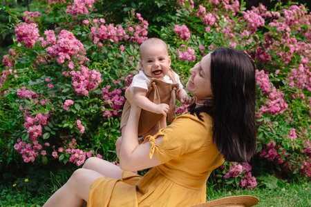 Joyful Mother and Baby in Blooming Garden
