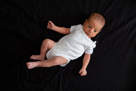 Newborn Baby on Black Background