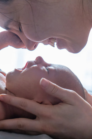 Tender Moment Between Mother and Newborn