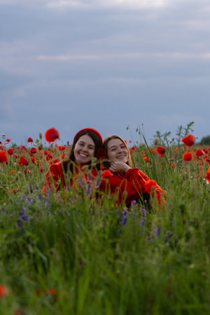 Women in Red in a Poppy Fieldの写真素材