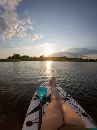 Relaxing on a Paddleboard at Sunset