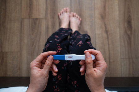 Positive Pregnancy Test in Handの写真素材