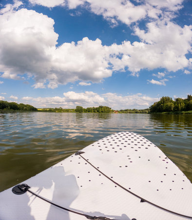 Paddleboarding on a Serene Lakeの写真素材