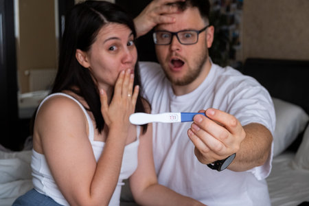 Happy Couple Celebrating Positive Pregnancy Test