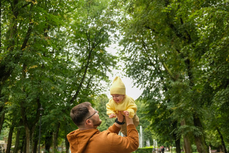 Father and Baby Enjoying Park Timeの写真素材