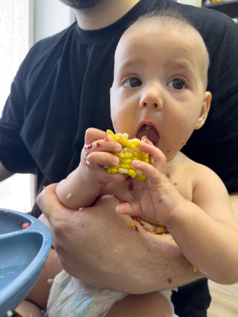 Baby Enjoying Corn on the Cobの写真素材