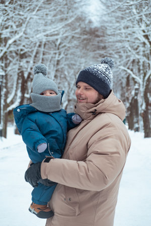 Father and Child in Winter Parkの写真素材