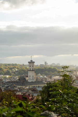 Cityscape with Prominent Clock Tower and Greenery