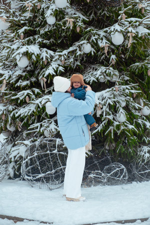 Winter Family Bonding by Snowy Christmas Tree