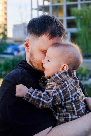 Father and Baby Smiling Outdoors