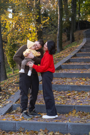 Happy Family in Autumn Parkの写真素材
