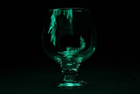 A glass in the darkの写真素材