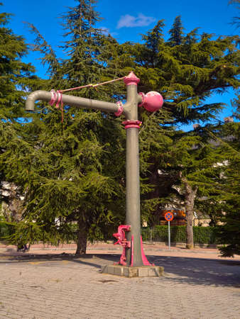 railway water pump. monument. old tree. skyの写真素材