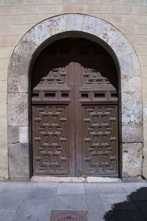door gate monument wood old entrance alcala de henares spainのeditorial素材