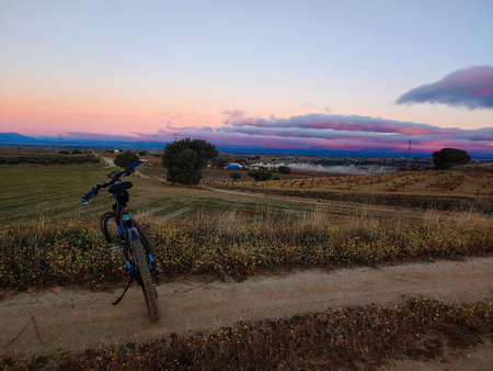 bike landscape mountains sky clouds trees viewの写真素材