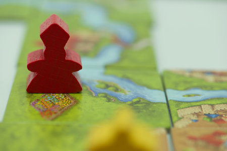 Map of the world with a red plastic figure of a man.の写真素材