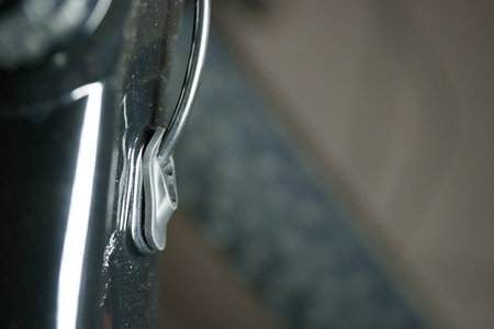 A closeup shot of the handle of a car with a blurred background
