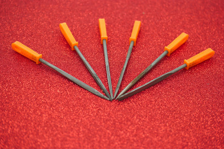 Set of screwdrivers on red background. Shallow depth of field.の写真素材