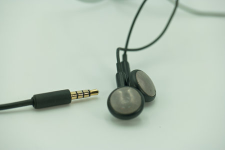 Earphones on a white background. Close-up. selective focus.