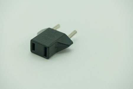 black power plug isolated on white background, closeup of photo.