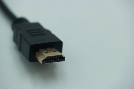 HDMI cable isolated on white background. Selective focus and shallow depth of field.の写真素材