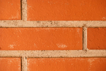 Orange brick wall texture background. Red brick wall texture. Red brick wall background.