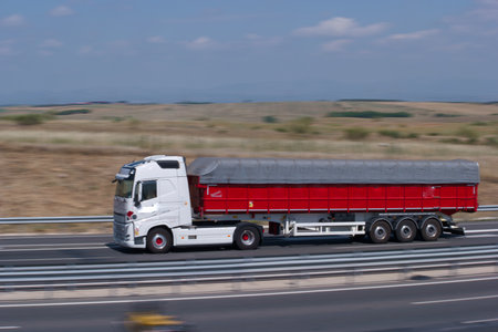 Truck with trailer on motorway. Transportation of goods and cargo.の写真素材
