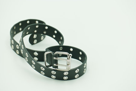Leather belt isolated on white background - vintage filter and soft focus