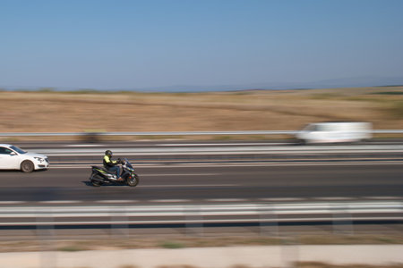 Motorcycle racing on the highway.